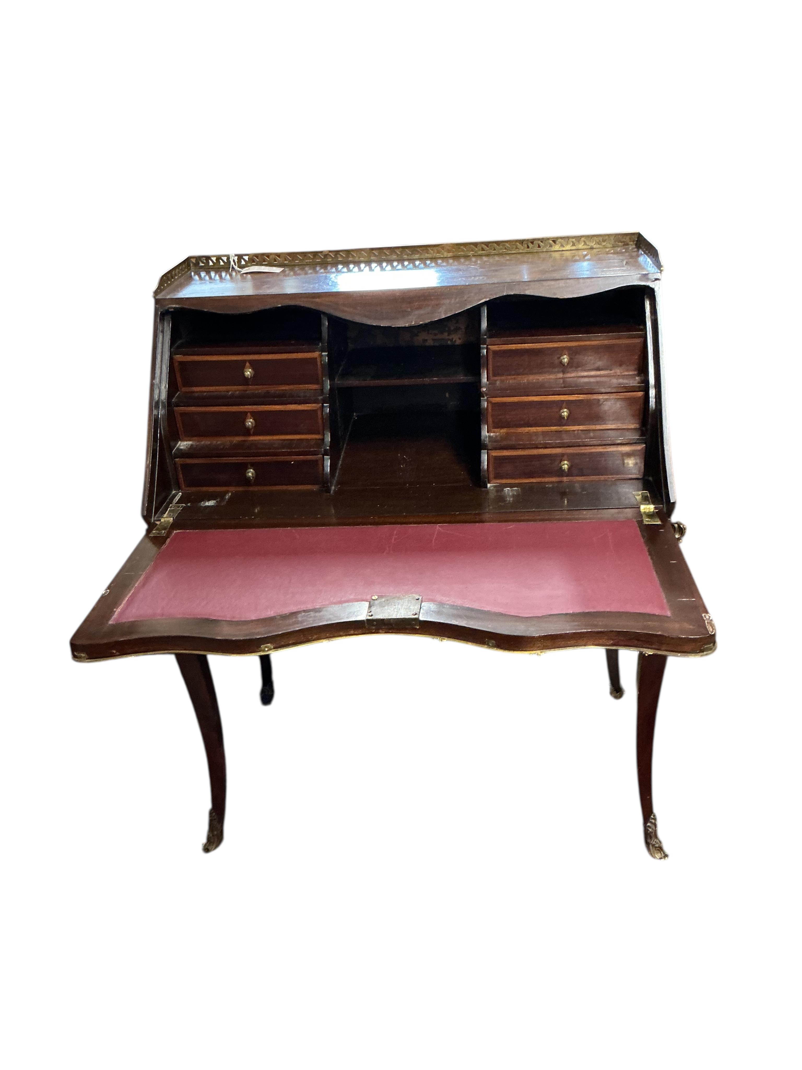 A Louis XVI style gilt metal mounted kingwood bureau de dame, width 84cm, depth 45cm, height 103cm